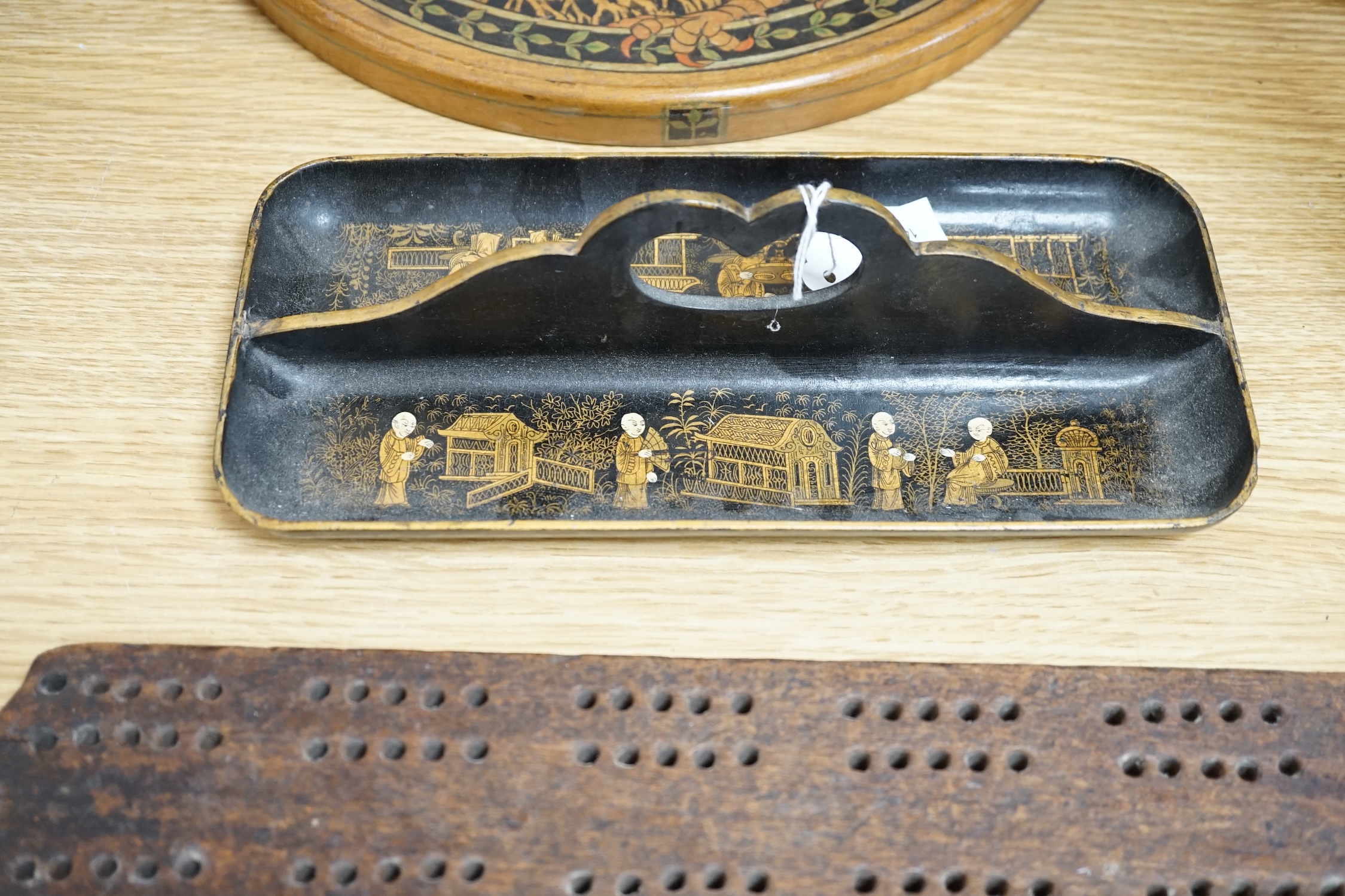 A group of wood items to include two cribbage boards, a mahogany solitaire board with marbles, a truncheon and an inlaid oval tray. etc., largest 60cm wide. Condition - varies, poor to fair